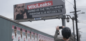 Baliho Julian Assange | Fair Observer